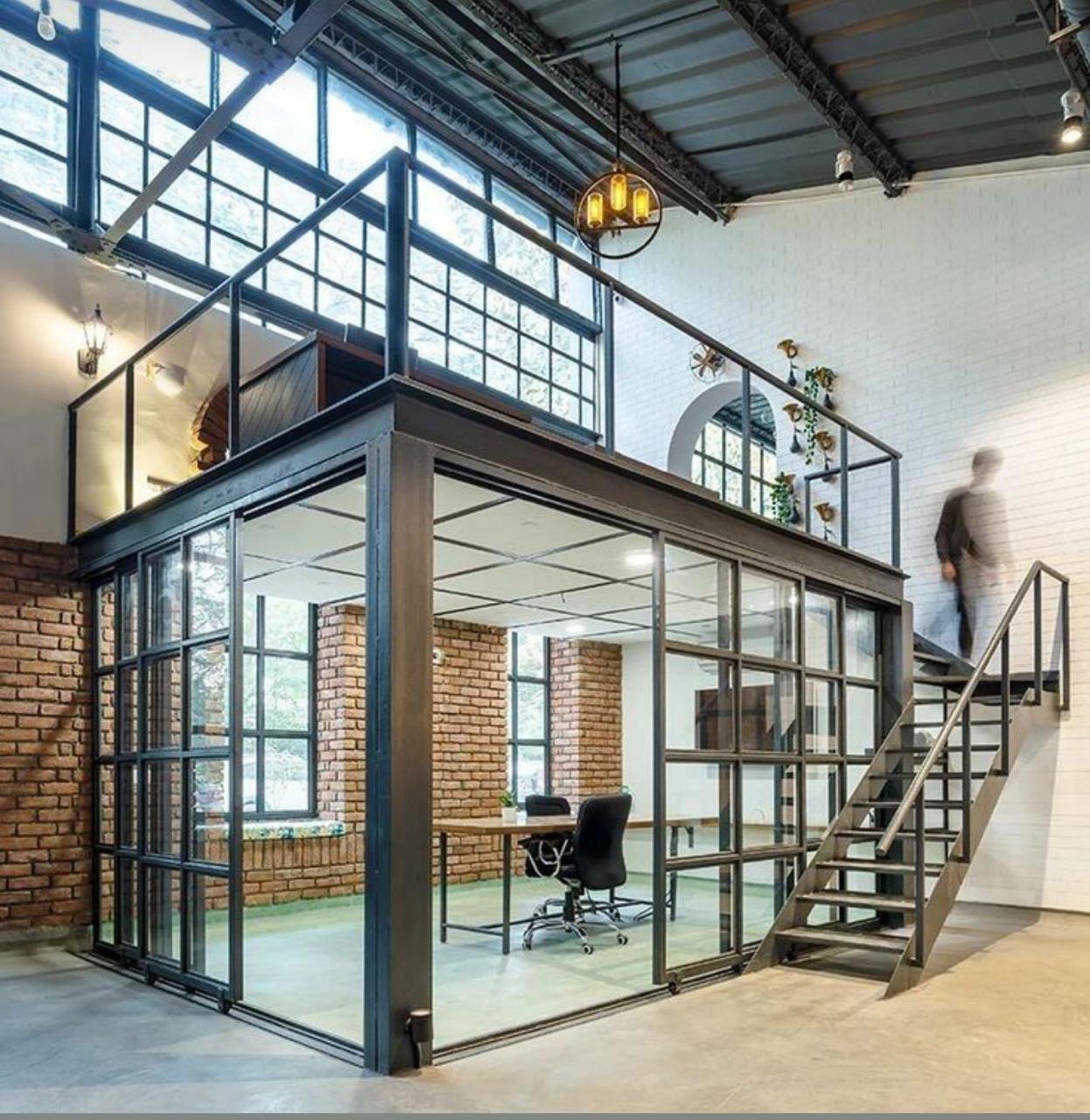 Construction site with modern steel structure work in progress with architects reviewing blueprints